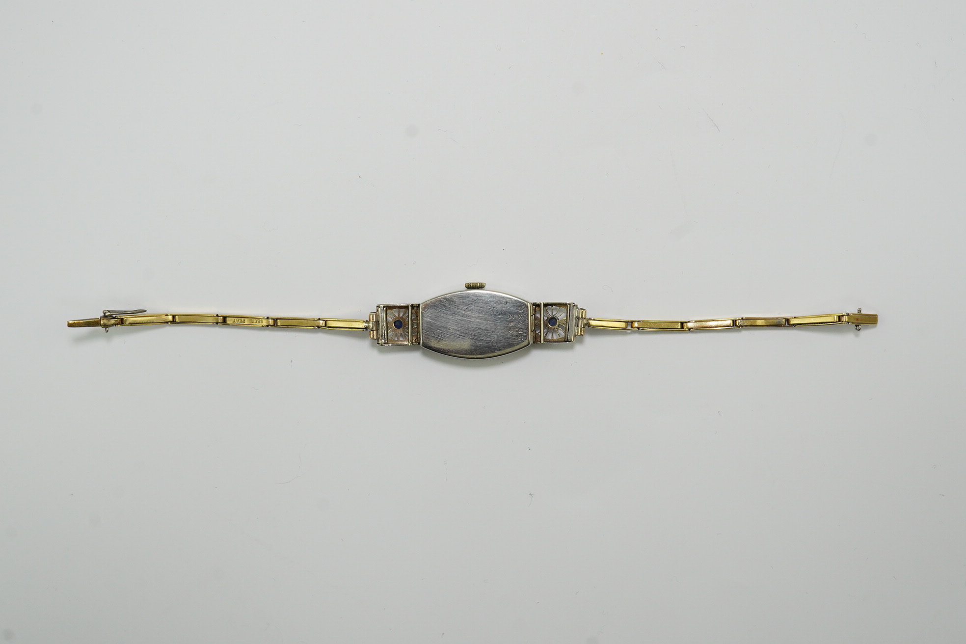 A lady's 1930's Art Deco pierced 18ct gold, sapphire and diamond set Rolex manual wind cocktail watch, on an 18ct gold and platinum expanding bracelet